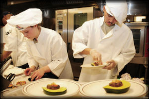 3 chefs working in a kitchen
